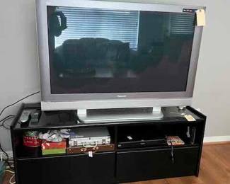 Large Screen TV and black lacquer credenza