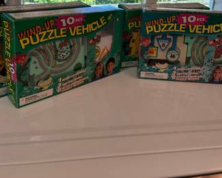 Assortment of Wind - Up Puzzle Vehicle Sets