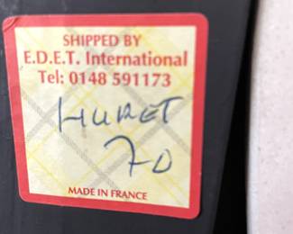 Marking on back of marble piece with carved wall art work. 