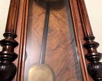 Walnut Vienna regulator style wall clock circa 1890, the movement striking on a gong, above a finialed and reeded lower section. H 55", W17.5.  $8,000