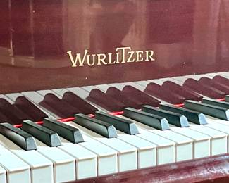 This Wurlitzer Baby Grand Piano with high polish mahogany finish plays like a dream!