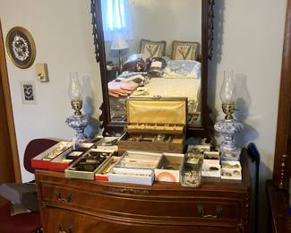 Vintage Bedroom set dresser & Mirror. Costume jewelry on the dresser.