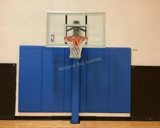 Several basketball posts, backboards & mats available