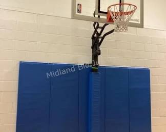 Several basketball posts, backboards & mats available