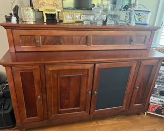 Nice, solid wood entertainment cabinet.