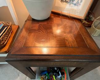 Solid wood end table.  This table can withstand a lot of weight on it.  It is a tank.  Beautiful wooden pattern on top.  