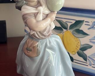 Lladro "Balloon Seller" piece.