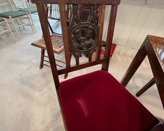 Beautiful antique solid wood chairs with beautiful medallion in the middle.  They have a velvet seat, and there are five of these.