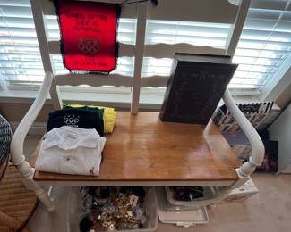 Two-seater bench.  I believe this matches a grouping of chairs, and could be used for seating around the table that has the matching legs. Of course this is sold separate from the table.  But just keep it in mind if you are looking for a Kitchen set.