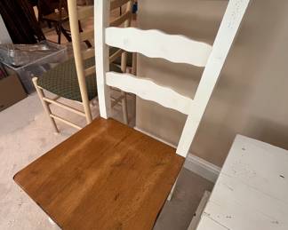 Two ladder back chairs.  There are several chair sets that possibly match the few tables that are in this home.  One is located upstairs in the kitchen, another is being used as a desk in the basement.  All chairs sold separately.