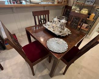 Burled wood Parson's Table.  Lovely design.  Very sturdy.  Chairs sold separately.