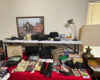 Lots of weather radios, vintage radios, Canon cameras, phones