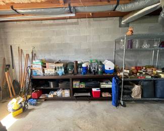 Canning items, camping items, large brown wood cabinet, yard tools