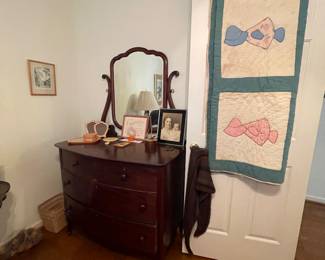 Antique dresser and Sun Bonnet Sue quilt