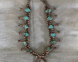 Several Squash Blossom Necklaces