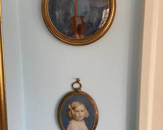 Two of the painted miniatures on porcelain