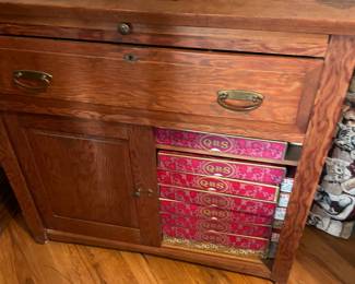 Antique chest. Rolls of music cylinders for player pianos