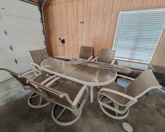$200 - Oval Glass top patio table with 6 swivel chairs. Umbrella w/Base sold separately. - GREAT CONDITION!