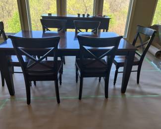$300 Solid wood dining table and 8 chairs with leaf in excellent condition.