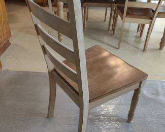 WINNERS ONLY INC - MADE IN MALASIA - SOLID WOOD DINING TABLE W/ SIX CHAIRS & 1 BUILT-IN PULL-OUT LEAVES - $200