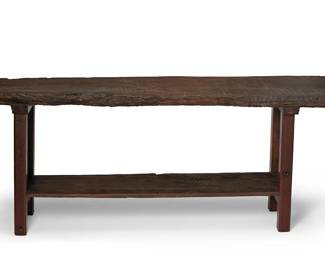 153
18th century
A Spanish Colonial Trestle Console Table
The wood table with rough edge timber top and undershelf
34" H x 83.5" W x 20" D
Estimate: $2,000 - $3,000
