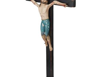 187
Late 19th century
A New Mexican Carved Wood Cristo
Possibly by Santero Juan Miguel Herrera (1835-1905), the polychromed carved Jesus figure mounted to an ebonized wood cross above a turned wood base
27.75" H x 14" W x 7" D
Estimate: $3,000 - $5,000