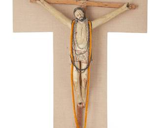 186
Early 19th century
A New Mexican Tabernacle Crucifix Statuary
The carved and painted wood crucifix later adorned with various silvered metal and felt jewelry items, mounted to a custom cruciform pinewood and linen frame
Crucifix: 31.5" H x 22" W x 5" D; Frame: 36.5" H x 28.625" W x 1.5" D
Estimate: $800 - $1,200