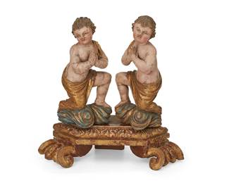 151
18th/19th century
Two Latin American Carved Wood Putti
Each carved, polychromed, and giltwood child figure swathed in fabric with clasped hands in prayer, mounted to a carved giltwood base with scrolled feet
Overall: 13.25" H x 12.75" W x 5.5" D
Estimate: $800 - $1,000