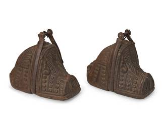 208
19th century; Chile/Argentina
A Pair Of South American Carved Wood Stirrups
After Spanish Colonial design, the wood stirrups with blunt tips, various carved motifs, and cast iron oxbow straps, 2 pieces
Each: 7.625" H x 6.125" W x 8.75" D approximately
Estimate: $500 - $700
