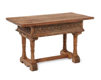 152
Late 18th/early 19th century
A Spanish Colonial Carved Wood Trestle Table
The carved fruitwood table with ornate floral friezes to each side and reed and bead edges, raised on baluster legs joined by an H-stretcher
29.5" H x 48.75" W x 26.25" D
Estimate: $800 - $1,200