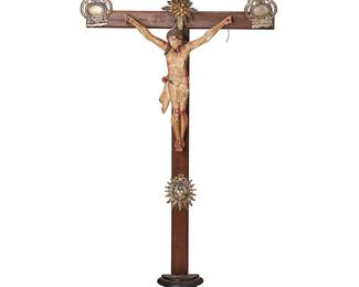 183
Late 19th century
A Latin American Wood And Silver Altar Crucifix
The wood cross with repoussé silver flourishes at the terminuses, one bearing the Titulus Crucis and one with mounted glass or stone accent centering a holy light medallion, above the mounted polychromed plaster Jesus figure, all mounted on a half-turned ebonized wood base
28.25" H x 13" W x 3" D
Estimate: $800 - $1,200
