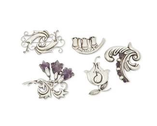238
A Group Of Fred Davis Mexican Silver And Amethyst Brooches
Frederick W Davis (1880-1961)
Circa pre-1948; Mexico City, Mexico
Each stamped: FD; further variously stamped: Silver / Mexico / 925 / Made in Mexico
Five brooches in stylized floral and foliate motifs including one brooch with carved amethyst flowers and one with set amethyst cabochons, 5 pieces
Largest: 2.75" H x 3.5" W; Smallest: 1.25" H x 2.5" W
106.3 grams gross
Estimate: $700 - $900