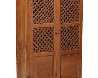 162
19th century
A Latin American Wood Cupboard
The pine cabinet with iron hardware and two hinged lattice-front doors revealing three shelves and a latch locking mechanism
58.5" H x 37.75" W x 18" D
Estimate: $1,000 - $1,500