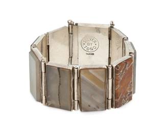245
An Antonio Pineda Mexican Silver And Stone-Set Bracelet
Antonio Pineda (1919-2009)
Circa 1948-1953; Taxco, Mexico
Stamped: Silver By Tono [within circle] / Taxco
A chunky Silver by Tono link bracelet with various rectangular set stones including agate
6.5" L x 1.25" H
101.4 grams gross
Estimate: $800 - $1,200
