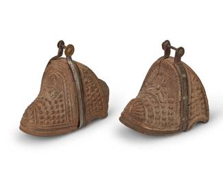 209
19th century; Chile/Argentina
A Pair Of South American Carved Wood Stirrups
After Spanish Colonial design, the wood stirrups with pointed tips, various carved motifs, and cast iron oxbow straps, 2 pieces
Each: 7.5" H x 5.75" W x 8.75" D approximately
Estimate: $500 - $700