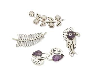 268
A Group Of Hector Aguilar Mexican Silver And Amethyst Brooches
Hector Aguilar (1905-1986)
Circa 1940-1945, 1943-1948, 1948-1962; Taxco, Mexico
Each stamped: HA [conjoined] / 940 / Taxco; further variously marked: .940 / Mexico / [Eagle 9]
Four works in sterling silver comprising a stylized parrot brooch with set amethyst cabochon head (3" H x 1.5" W), a leaf brooch with carved amethyst leaf accents (1.5" H x 3" W), and two further curved foliate motif brooches (Each: 1.25" H; 3.5" W and 3.25" W), 4 pieces
91.1 grams gross
Estimate: $500 - $700