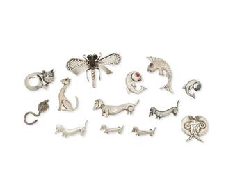 330
A Group Of Mexican Silver Animal-Themed Jewelry
Mid-20th century
Each variously stamped for sterling and Mexico; further variously stamped: Parra / [Eagle 34] / J.P.
A large group of Horatio Parra sterling silver animal brooches and a key holder including multiple dogs, cats, birds and fish, some with set stones, together with two J.P. stone set brooches including a dragonfly brooch with set onyx and a leaping fish brooch with set amethyst eye, 13 pieces
Largest: 2.375" H x 3.5" W; Smallest: 0.5" H x 1.375" W
77.7 grams gross
Estimate: $200 - $400