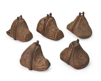 212
19th century; Chile/Argentina
A Group Of South American Carved Wood Stirrups
After Spanish Colonial design, the wood stirrups with blunt or rounded tips, various carved motifs, and cast iron oxbow straps, three featuring silver inlay, 5 pieces
Largest: 7.125" H x 5.875" W x 9" D; Smallest: 6.5" H x 5.75" W x 7.5" D
Estimate: $400 - $600