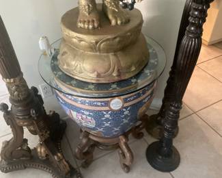 Brass goddess is standing on Persian Chinese pot.  Figures depict Chinese, writing in Persian