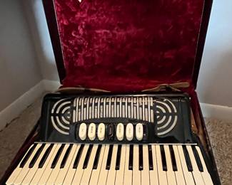 Accordion and case......