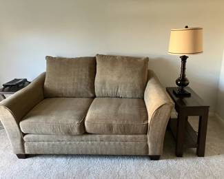 Love seat with tan upholstery