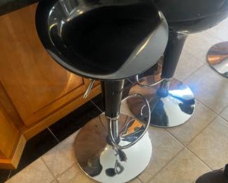 Black chair adjust high and low for counters