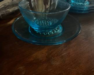 Set of blue cups with saucers
