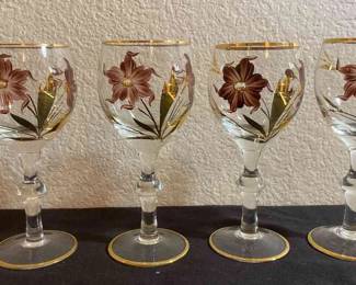 Gold Trimmed Wine Glasses With Dark Flowers And Gold Leaves 