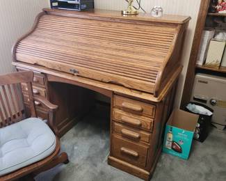 Excellent working condition, true antique roll top desk with chair. Top rolls easily. Dest moves in two pieces! 