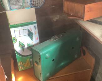 Coleman stove , children’s bench with some stuffed animals