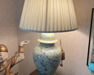 This 1980s big lamp with lots of presence measures 38 inches. Hand-painted white and turquoise blossoms along brown branches decorate the 19-inch soft yellow ceramic ginger jar. The wooden base is 9" in diameter. The pleated shade is in good shape and measures 20" diameter x 16" high. The yellow round ceramic finial adds a nice finishing touch.
It has two bulbs with pull chain switches, and also has a cord switch. $110