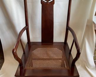 Two Ming-style mahogany dining armchairs and six side chairs are part of the Henredon vintage chinoiserie dining set. All include custom seat cushions shown in the next photo. "Chinoiserie" is when Western artists adapt Asian art to enhance western-style furnishings and decor. Based on admiration of Asian art, chinoiserie has been a Western decorative art tradition since the 1700s. Contact us to view the nine-piece dining set before the estate sale on Friday.