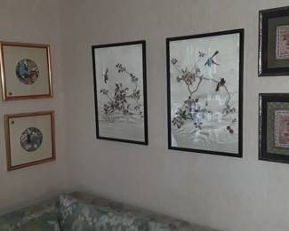 Framed Asian embroideries and prints
