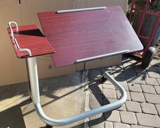 Adjustable height and angle over-the-bed table.